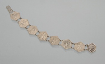 Appraisal: A Chinese Silver Bracelet with Figures Constructed with seven hexagonal