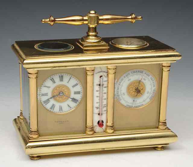 Appraisal: A FRENCH BRASS CASED CARRIAGE TIMEPIECE AND BAROMETER retailed by