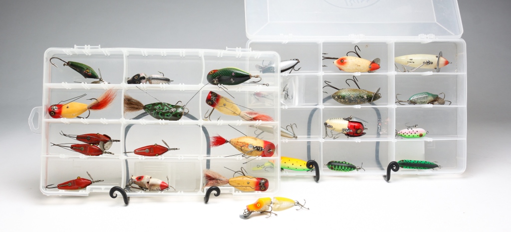 Appraisal: TWENTY-FOUR HEDDON FISHING LURES INCLUDING WOOD American th century Featuring