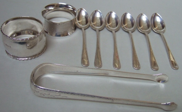 Appraisal: Silver comprising a pair of Irish sugar tongs crest engraved