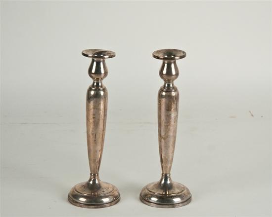 Appraisal: A Pair of Sterling Candlesticks with urn-form candle cups tapered