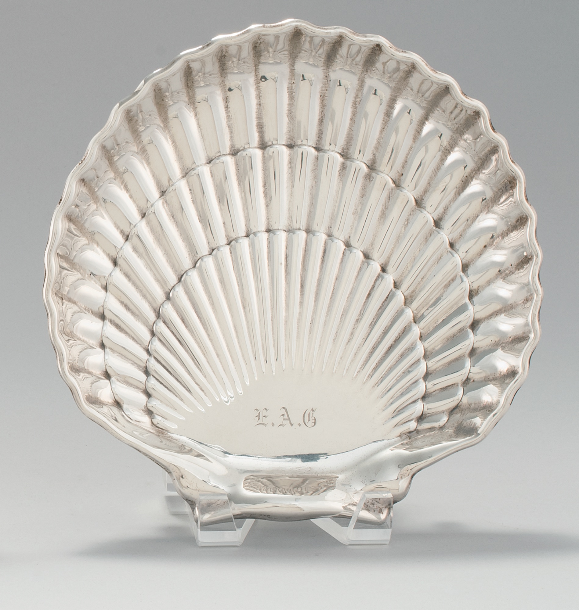 Appraisal: GORHAM STERLING SILVER SHELL-FORM DISH On two ball feet Monogrammed