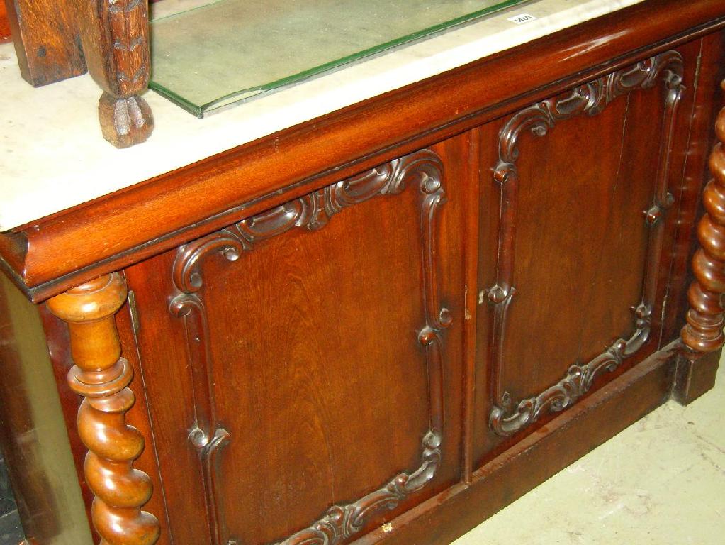 Appraisal: A Victorian mahogany sideboard the raised mirror back with carved