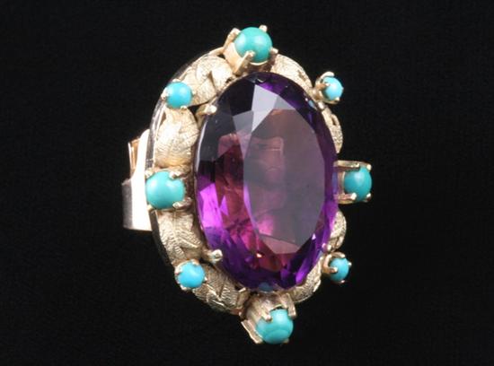 Appraisal: K YELLOW GOLD AMETHYST AND TURQUOISE RING Fancy-cut oval amethyst