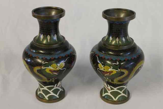 Appraisal: A PAIR OF BLACK GROUND CLOISONNE VASES with dragon design