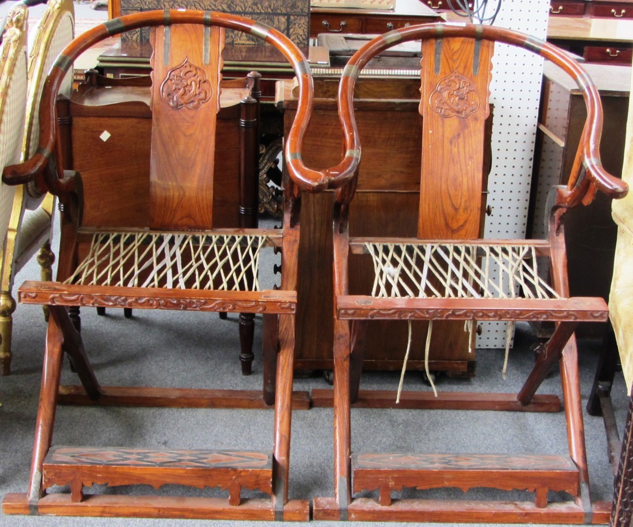 Appraisal: A pair of early th century Chinese hardwood folding horseshoe