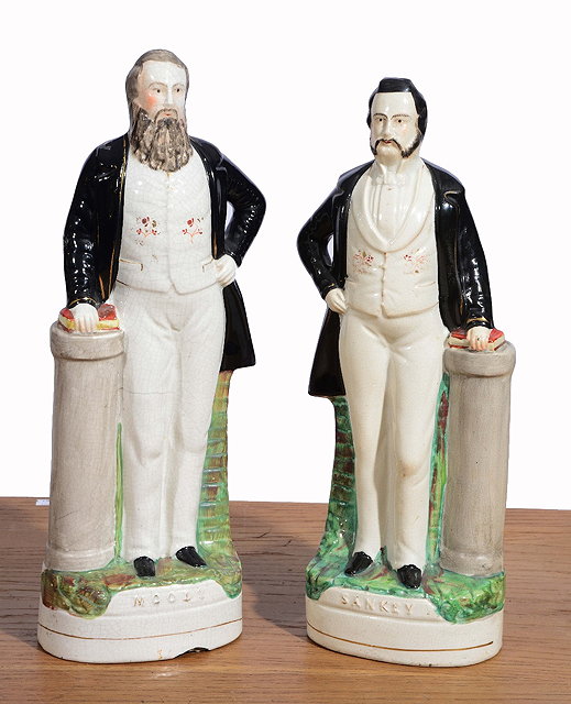 Appraisal: A PAIR OF LARGE STAFFORDSHIRE POTTERY PORTRAIT FIGURES of Moody