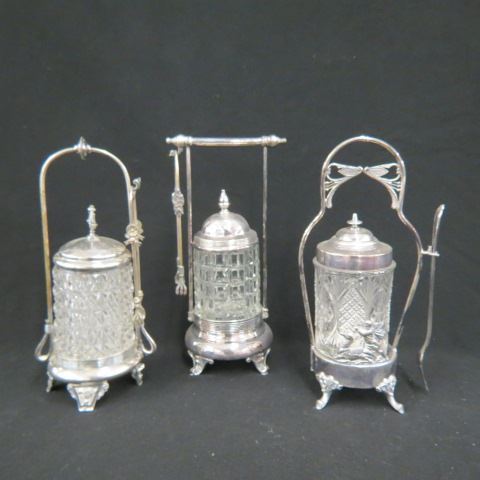 Appraisal: Victorian Pickle Castors pattern glass inserts with tongs pickle fork