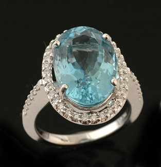 Appraisal: An aquamarine and diamond dress ring The oval cut aquamarine