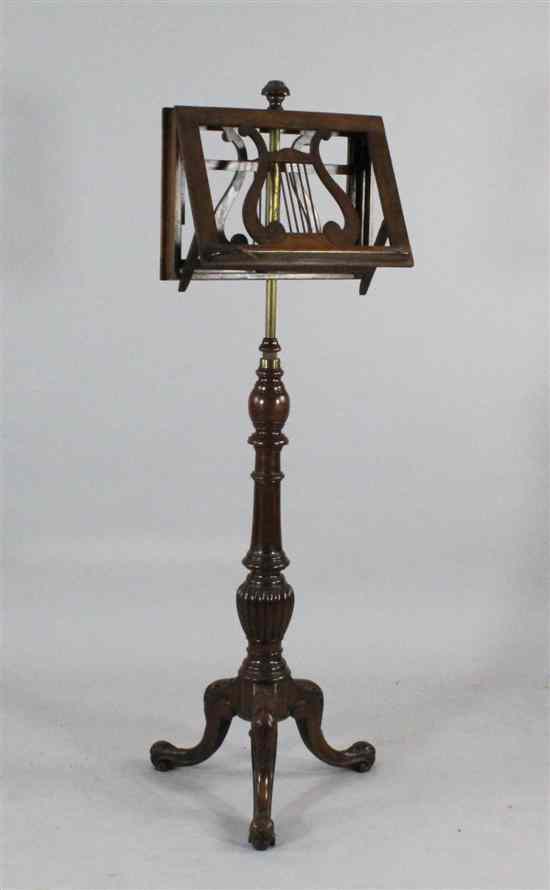 Appraisal: A Victorian walnut duet stand with telescopic stem and tripod