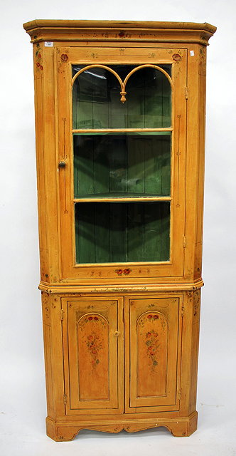 Appraisal: A POLYCHROME PAINTED FLOOR STANDING CORNER CUPBOARD with glazed upper