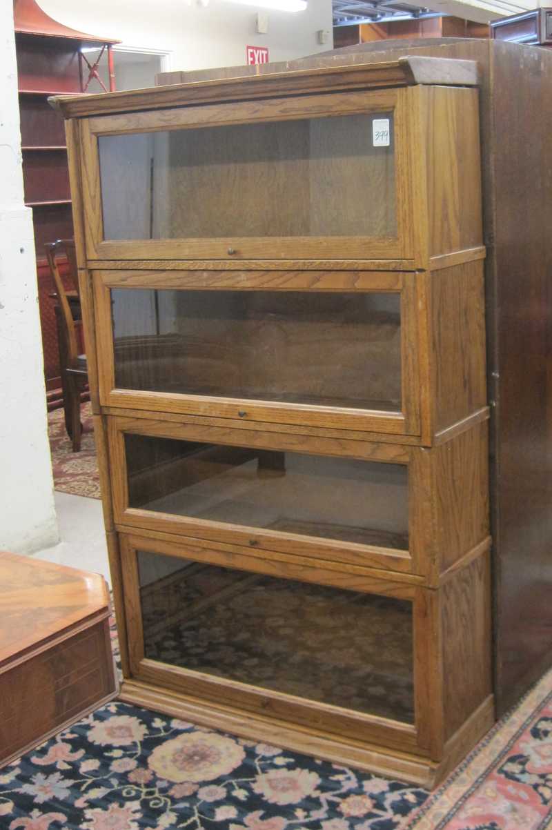 Appraisal: A 'STACKING' OAK BOOKCASE American antique reproduction having four horizontal