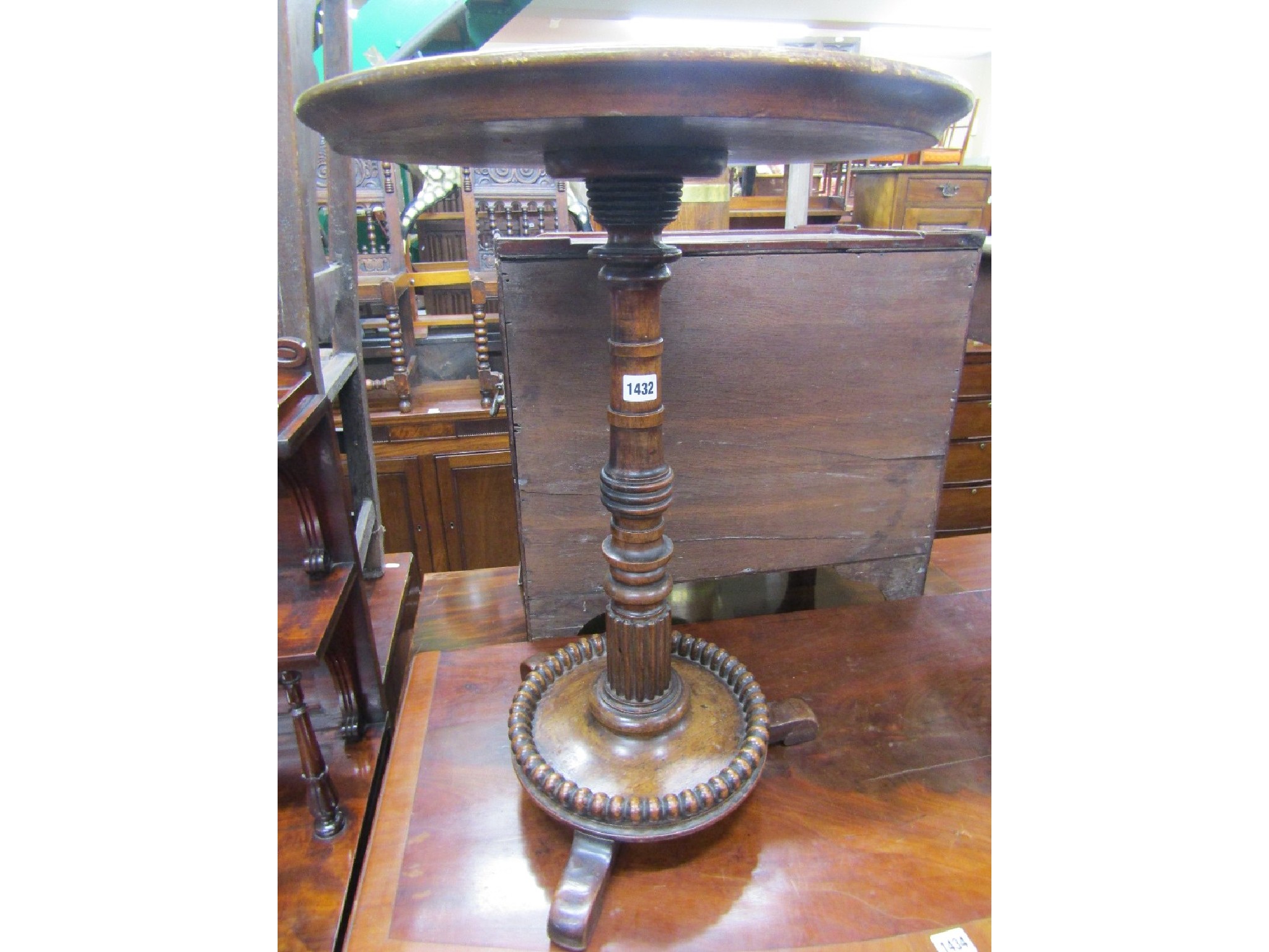 Appraisal: A mid- th century rosewood mahogany occasional table the circular