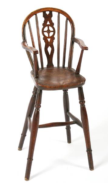 Appraisal: An English oak elm and yew child's Windsor high chair