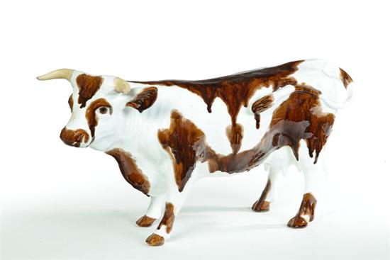 Appraisal: CERAMIC COW American th century Standing cow with white and