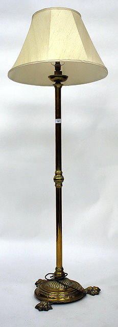 Appraisal: A VICTORIAN BRASS STANDARD LAMP with fluted cylindrical base and