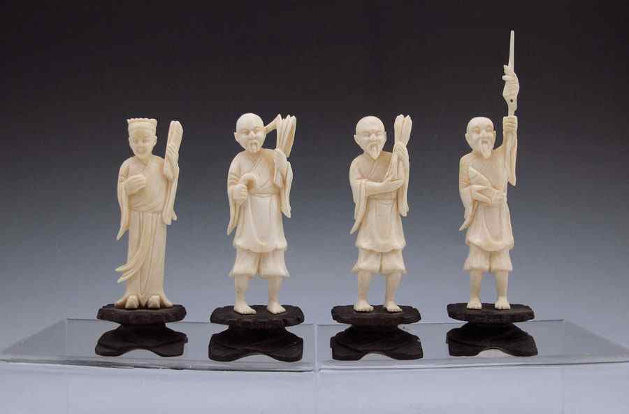 Appraisal: CARVED IVORY FIGURES IN PRESENTATION CASE Figures depict scholar farmers