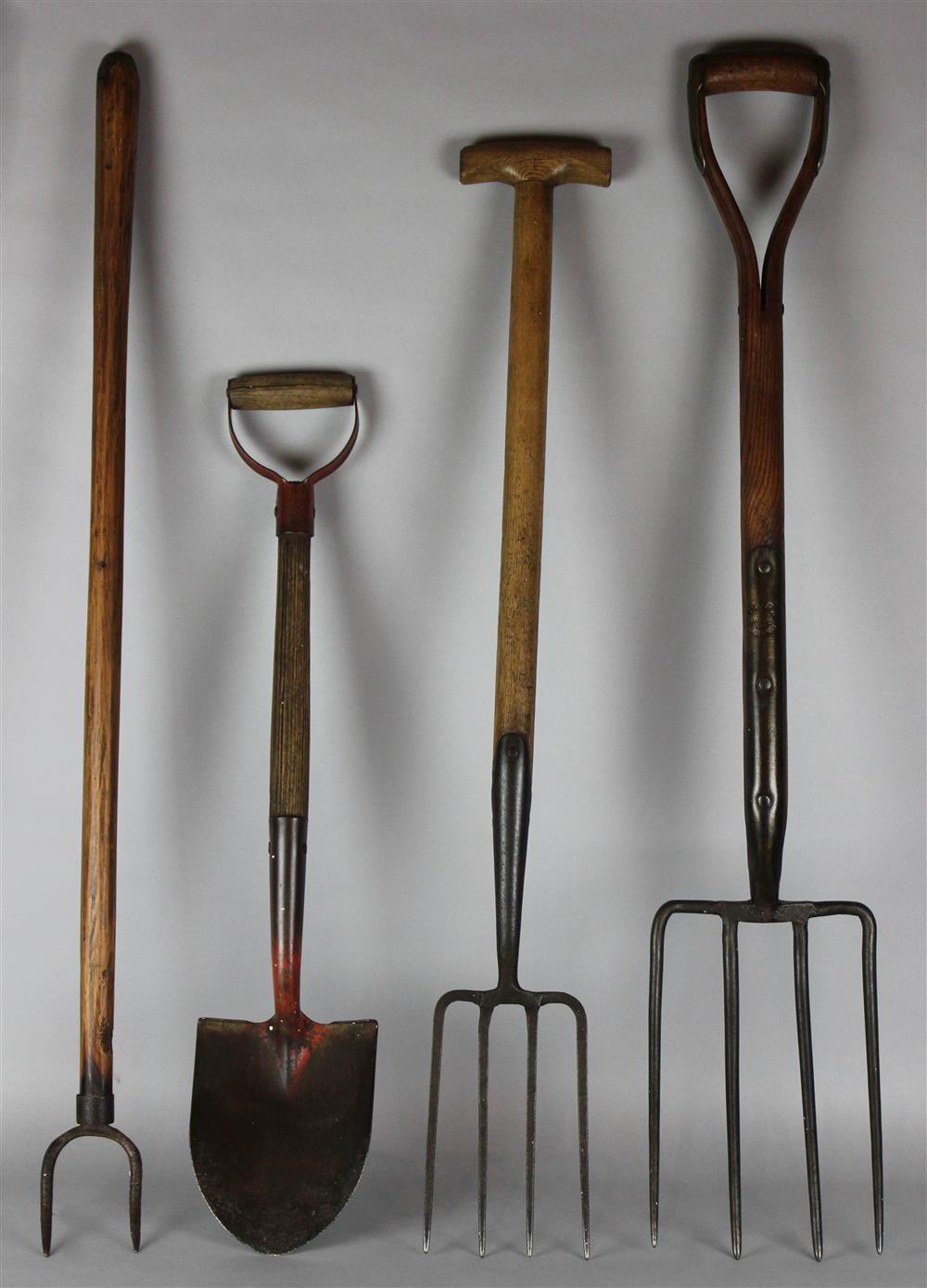 Appraisal: FOUR VINTAGE GARDENING TOOLS all with wood shafts including two