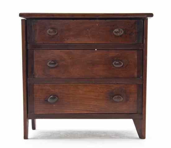 Appraisal: An American Pine Diminutive Chest of Drawers having a rectangular