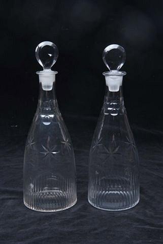 Appraisal: A PAIR OF REGENCY GLASS DECANTERS and stoppers with cut