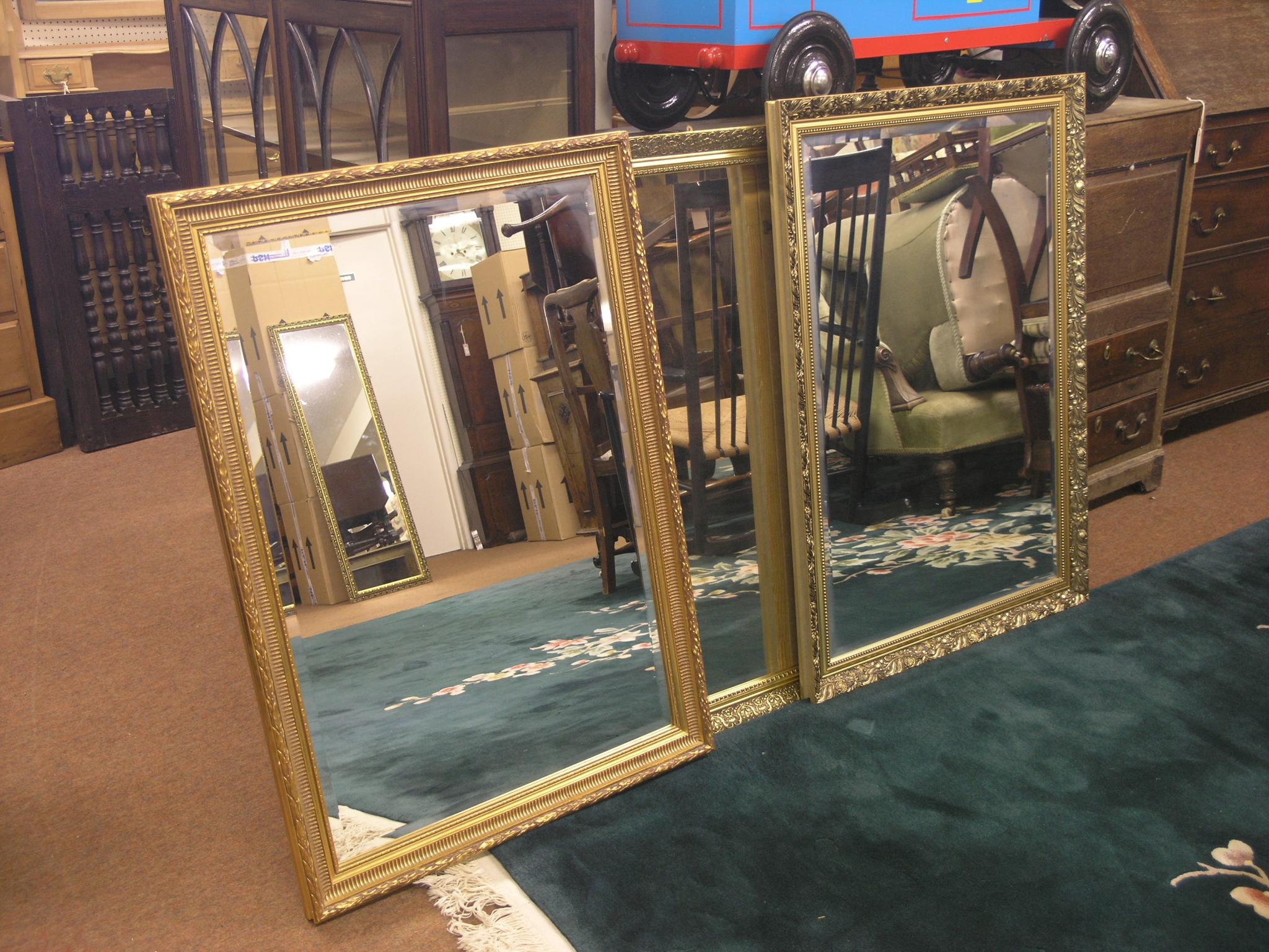 Appraisal: Four large gilt-framed mirrors each with bevelled plate generally ft