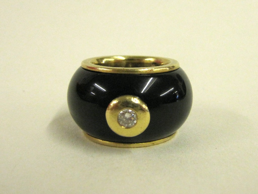 Appraisal: Eighteen carat gold mounted onyx band with diamond inset