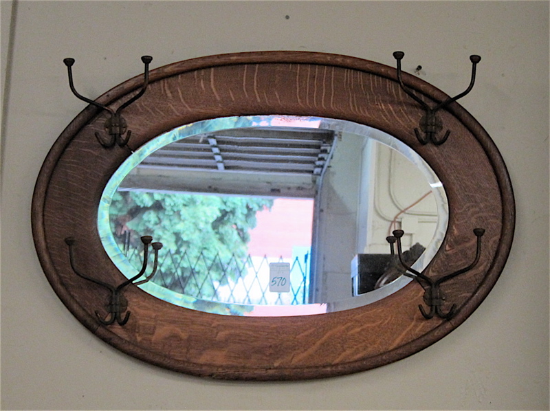 Appraisal: OVAL WALL MIRROR HATRACK American c a horizontal beveled mirror