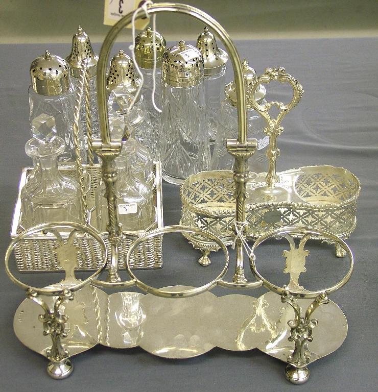 Appraisal: Three bottle decanter stand with an arched swing handle high