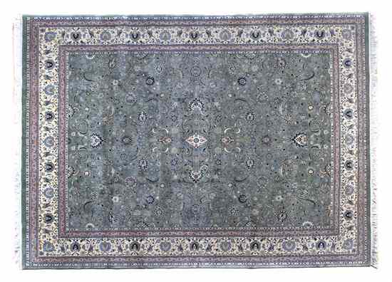 Appraisal: A Kashan Wool Rug having concentric diamond forms on an