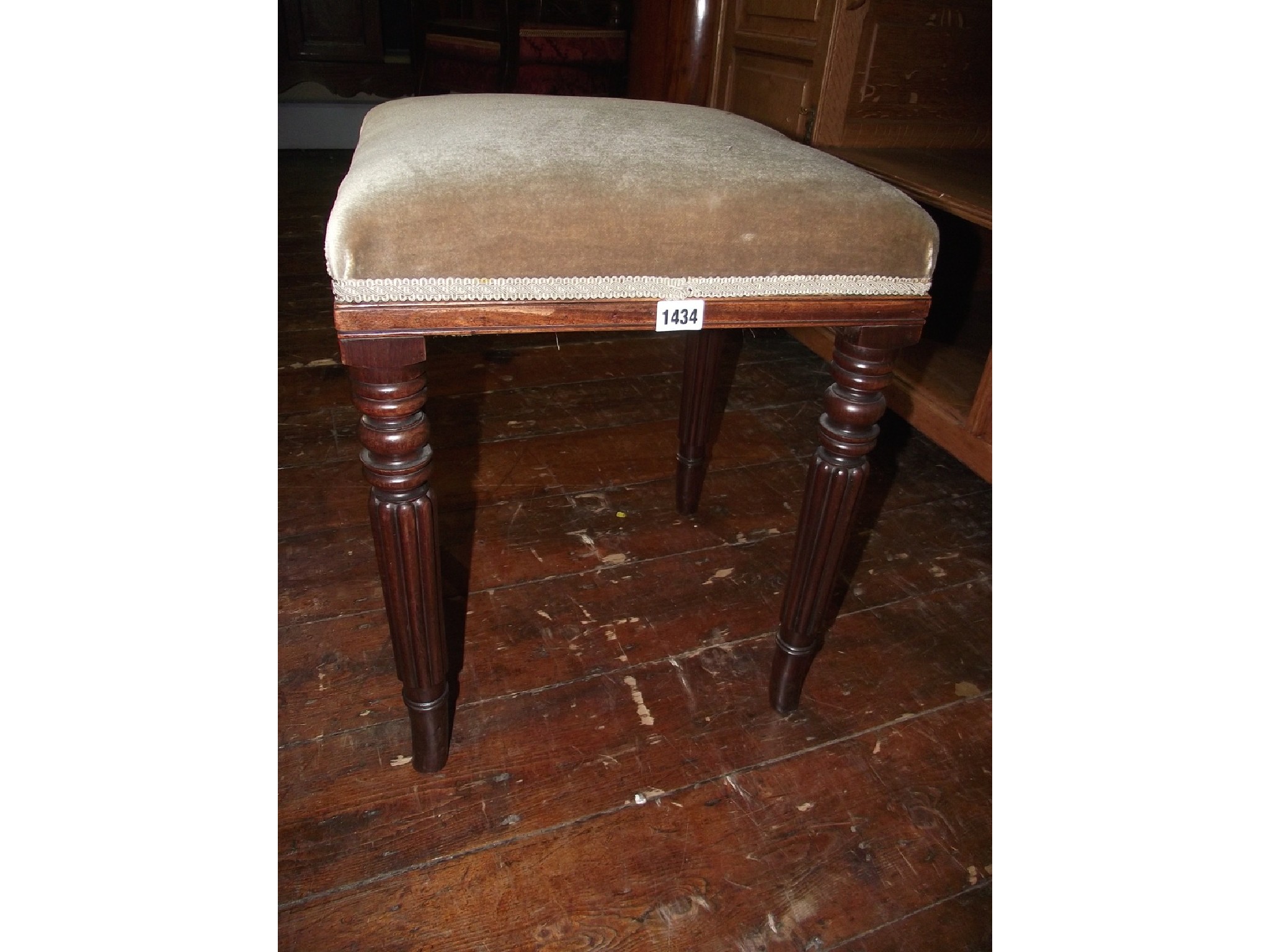 Appraisal: A Regency mahogany stool raised on four turned and fluted