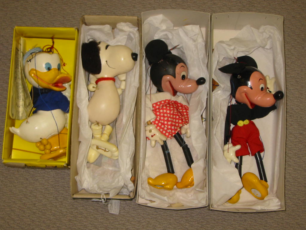 Appraisal: Four Pelham puppets SL Donald Duck yellow window box Snoopy