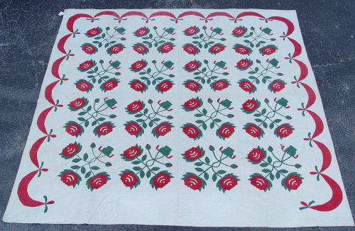 Appraisal: HAND QUILTED AND APPLIQUE RED GREEN ROSE QUILT The top