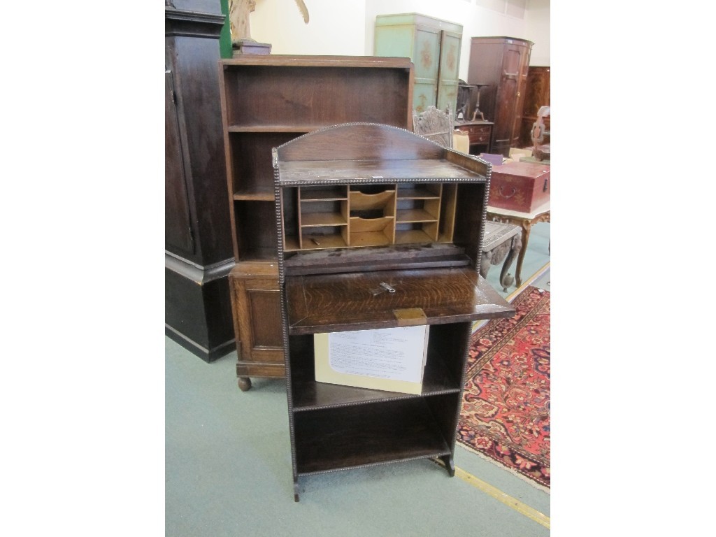 Appraisal: Oak open bookcase and an oak secretaire bookcase