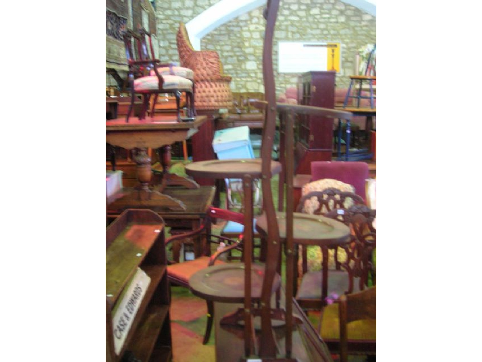 Appraisal: An inlaid Edwardian mahogany cake stand floorstanding and raised on