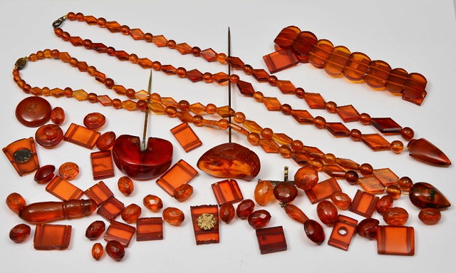 Appraisal: A COLLECTION OF AMBER including two strings of amber beads