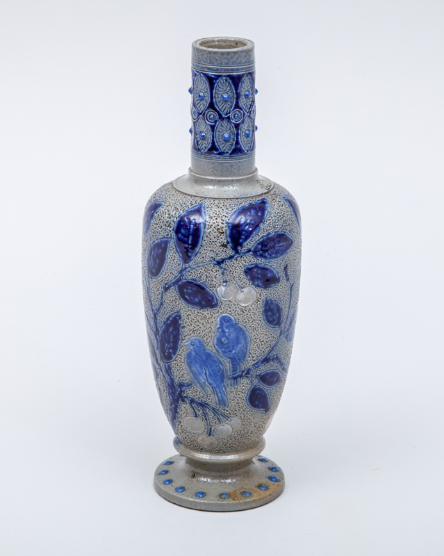 Appraisal: ROBERT W MARTIN BUD VASE Carved and stippled glazed earthenware