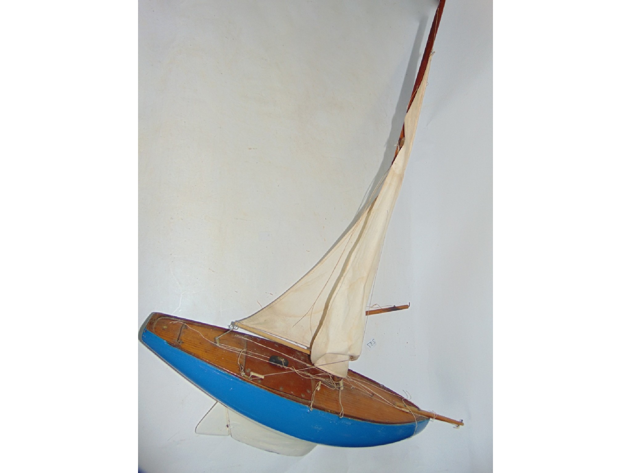 Appraisal: A th century painted timber pond yacht with canvas sail