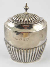 Appraisal: A late Victorian sterling silver oval half ribbed tea caddy