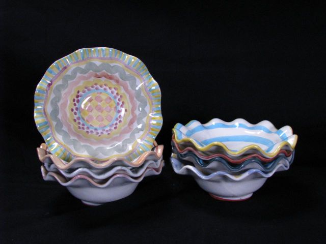 Appraisal: MacKenzie-Childs Artist Decorated Porcelain Plates including eight inch soup bowls