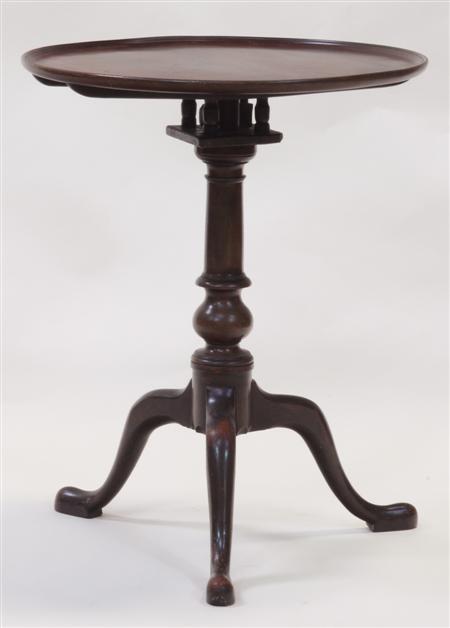 Appraisal: A th century mahogany wine table the circular top over