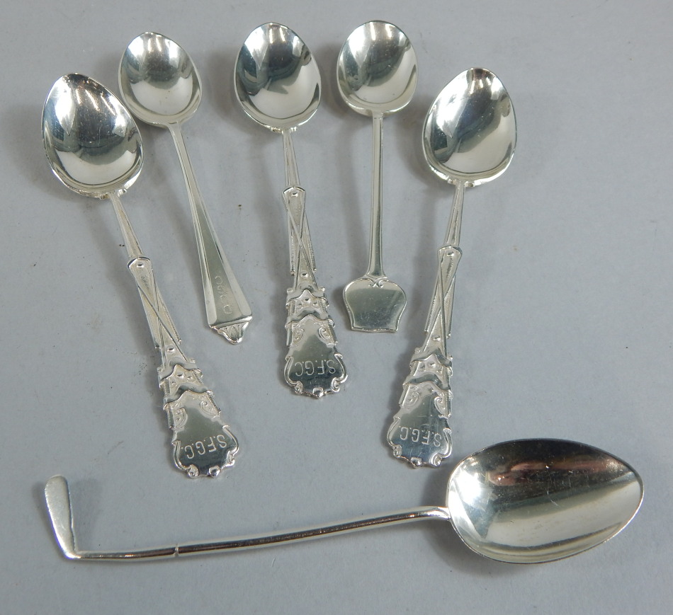 Appraisal: Various small silver golf related spoons each presented in the