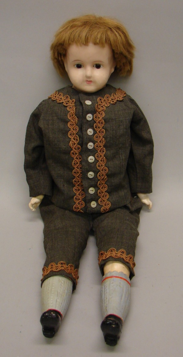 Appraisal: Wax over papier mache boy doll Stationary brown eyes closed