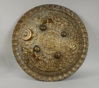 Appraisal: Indian Repousse Brass Shield Indian repousse brass shield depicting lions