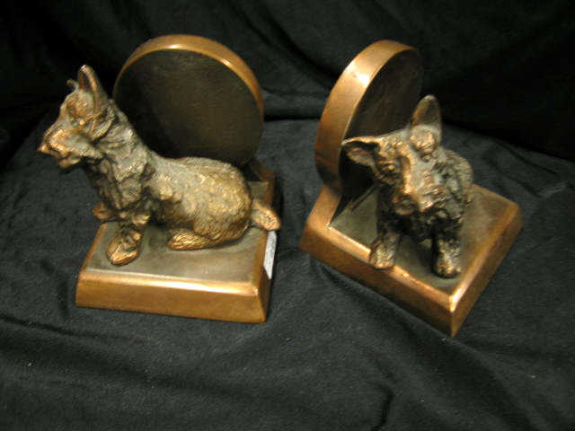 Appraisal: Scotty Figural Bookends copper finish deco era