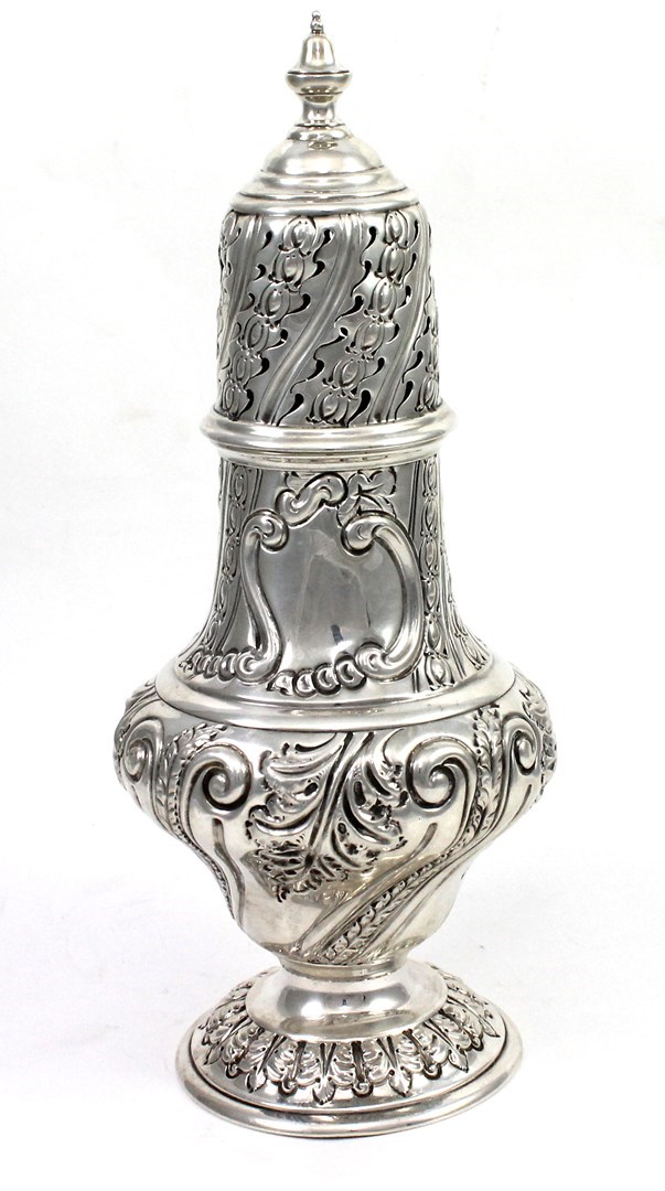 Appraisal: A Victorian silver large baluster shaped sugar caster with embossed