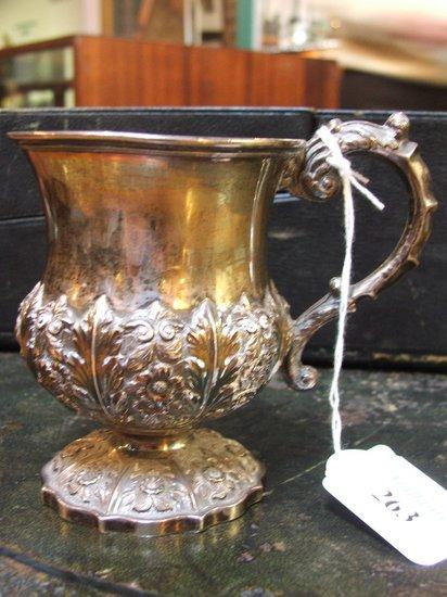 Appraisal: A GEORGE IV SILVER CHRISTENING MUG lower body chased with