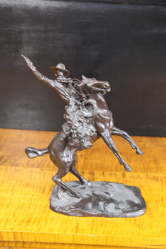 Appraisal: BRONZE AFTER RUSSELL ''Shooting up the Town'' Cowboy on a