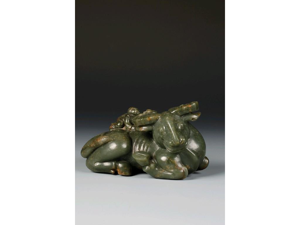 Appraisal: A CHINESE JADE OF A BOY climbing across the back