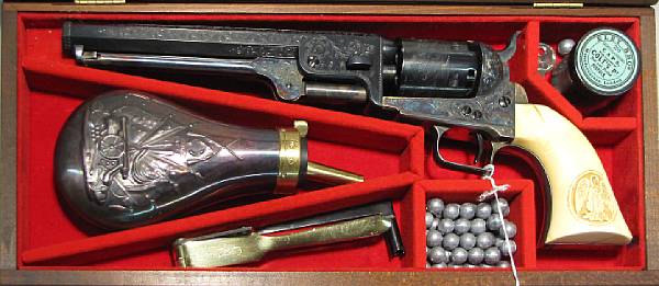 Appraisal: A cased and engraved reproduction Colt Model Navy percussion revolver