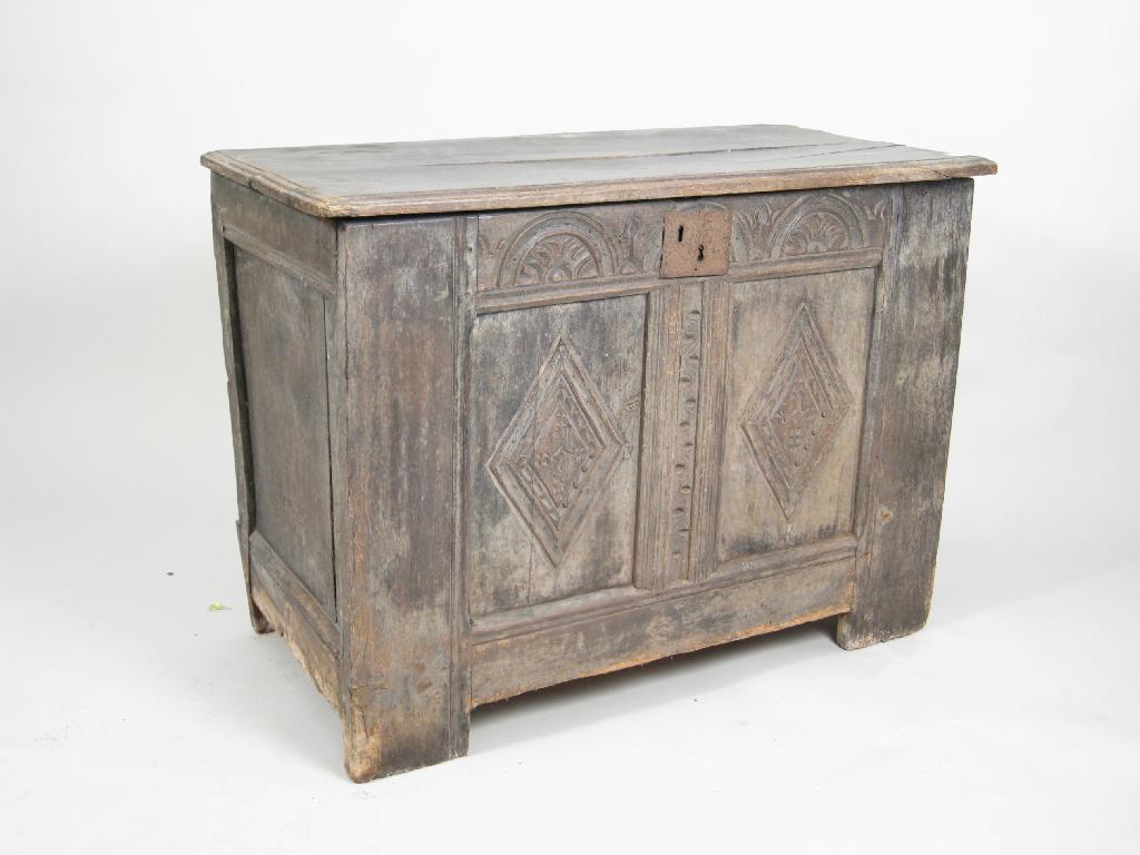 Appraisal: A small th Century oak Coffer having two carved panels